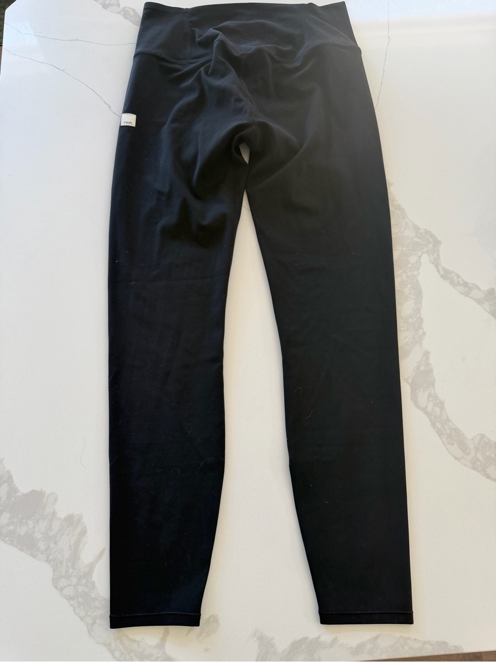 black Vuori leggings feature a high-rise waist women’s